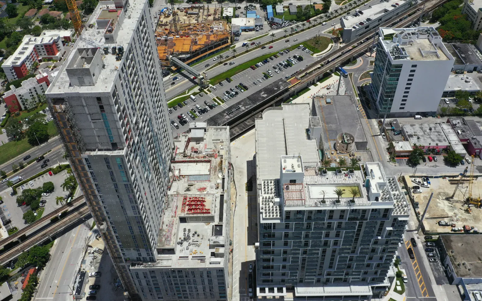 Aerial view of a high-rise construction project used to verify visible progress before a draw release.